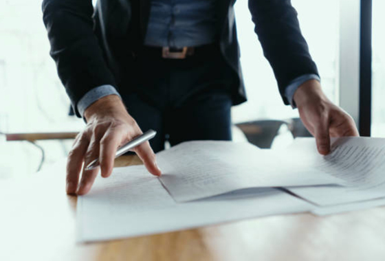 Man reviewing documents on a table